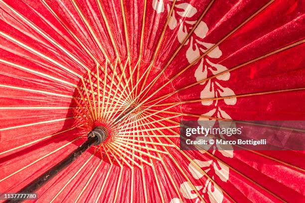 inside of japanese washi paper red umbrella - 傘　無人 ストックフォトと画像