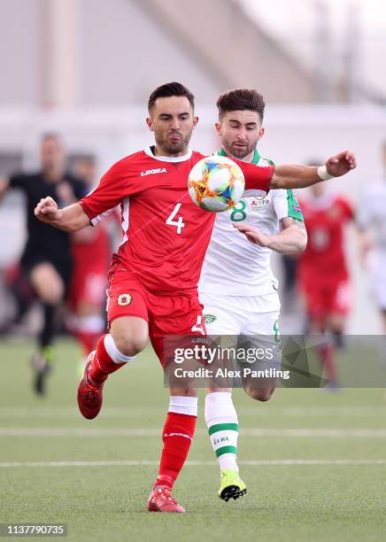 Jack Sergeant of Gibraltar is challenged by Sean Maguire of Republic of Ireland during the 2020 UEFA European Championships group D qualifying match...