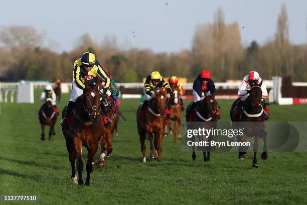 Noel Fehily riding Get In The Queue crosses the finish line to win his last race before retirement at Newbury Racecourse on March 23, 2019 in...