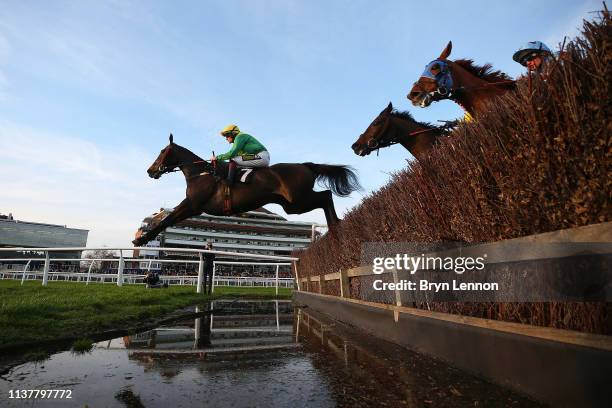 Sam Twiston-Davies riding Rock on Rocky clears an open ditch in the Sharps Brewery Rock Handicap Steeple Chase at Newbury Racecourse on March 23,...