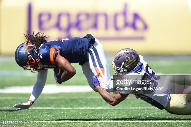 Louis Young of the Atlanta Legends tackles Donteea Dye Jr. #11 of the Orlando Apollos during the first half in an Alliance of American Football game...