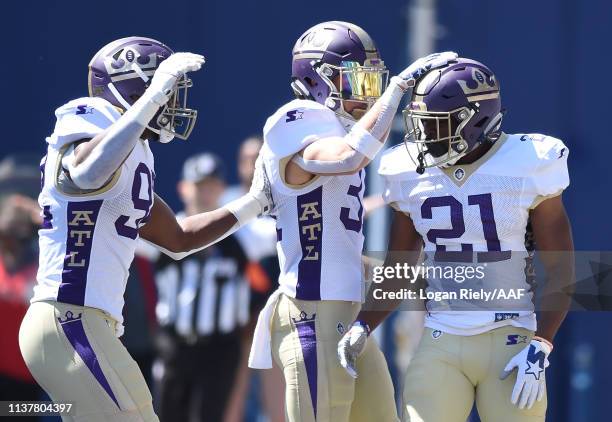 Doran Grant of the Atlanta Legends celebrates with teammates during the first half against the Orlando Apollos in an Alliance of American Football...