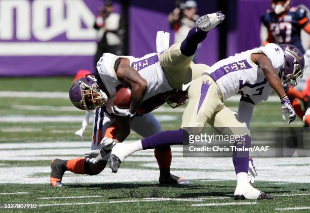 Tarean Folston of the Atlanta Legends is tackled by Josh Evans of the Orlando Apollos during the first half in an Alliance of American Football game...