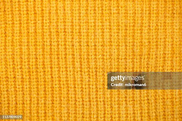 yellow sweater background - knitted stock pictures, royalty-free photos & images