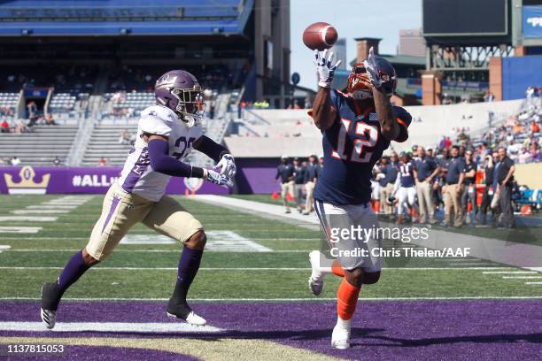 Charles Johnson of the Orlando Apollos catches a touchdown pass during the fourth quarter against Donatello Brown of the Atlanta Legends in an...