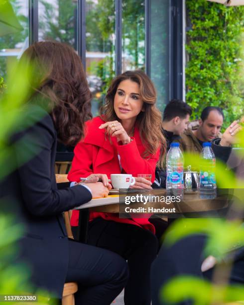 In this handout provided by the Royal Hashemite Court, Jordan's Queen Rania tours the Jabal Al-Luweibdeh neighbourhood on April 17 in Amman, Jordan....