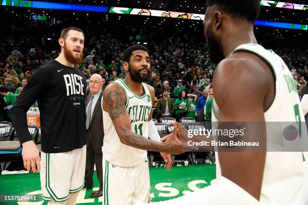 Kyrie Irving shakes hands with Jaylen Brown of the Boston Celtics after Game Two of Round One of the 2019 NBA Playoffs against the Boston Celtics on...