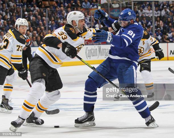 Zdeno Chara of the Boston Bruins drills John Tavares of the Toronto Maple Leafs in Game Four of the Eastern Conference First Round during the 2019...