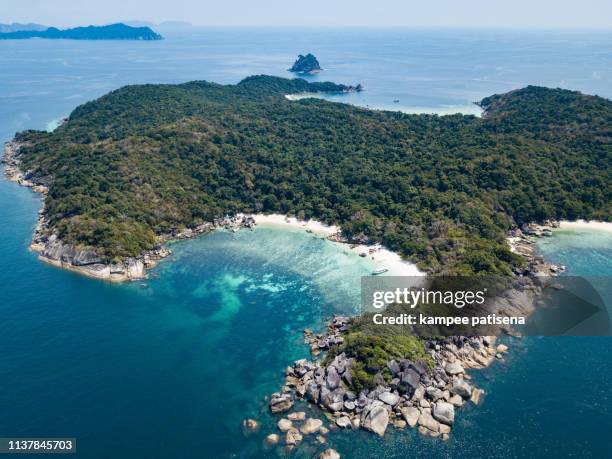 beautiful white sand beach at boulder island in andaman sea near ranong thailand, myanmar. - mergui archipelago stock pictures, royalty-free photos & images
