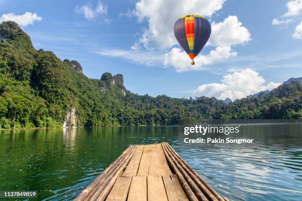 aerial view from colorful hot air balloons flying over with the lake at khao sok national park - kao sok national park imagens e fotografias de stock