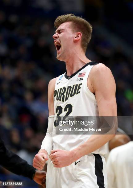 Matt Haarms of the Purdue Boilermakers celebrates his teams lead in the second half against the Villanova Wildcats during the second round of the...