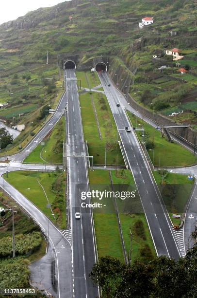 Cars drive on the highway connecting Ribeira Brava to Funchal, the capital of the Portuguese autonomous archipelo of Madeira, on April 9, 2008. Over...