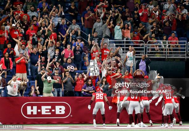 De'Vante Bausby of San Antonio Commanders celebrates his touchdown with teammates and fans late in the fourth quarter of the Alliance of American...