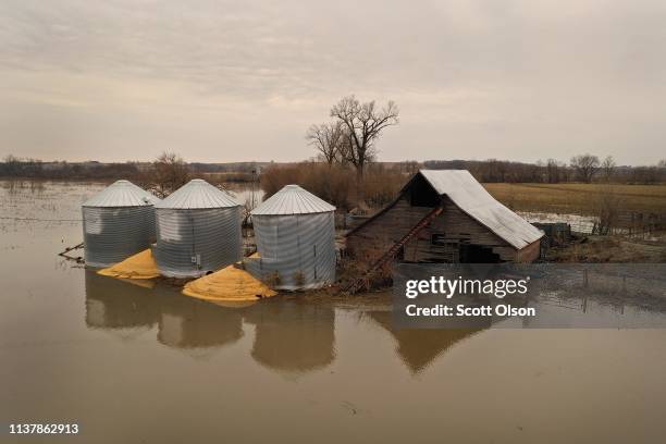 Corn burst from a grain bin which was soaked with floodwater on March 23, 2019 near Union, Nebraska. Damage estimates from flooding in Nebraska top...