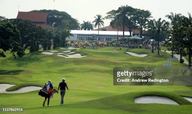 David Lipsky of the United States and his caddie walk up the second hole on during Day Four of the Maybank Championship at Saujana Golf & Country...
