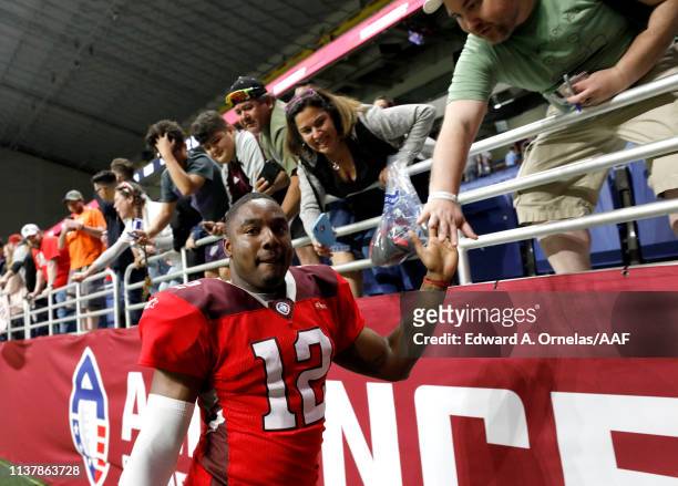 Marquise Williams of the San Antonio Commanders celebrates his team's 19-15 win over the Salt Lake Stallions with fans after the Alliance of American...