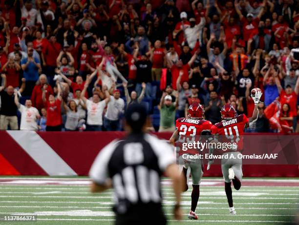 De'Vante Bausby of San Antonio Commanders runs towards the end zone to score followed by teammate Jordan Thomas after a pick off against the Salt...