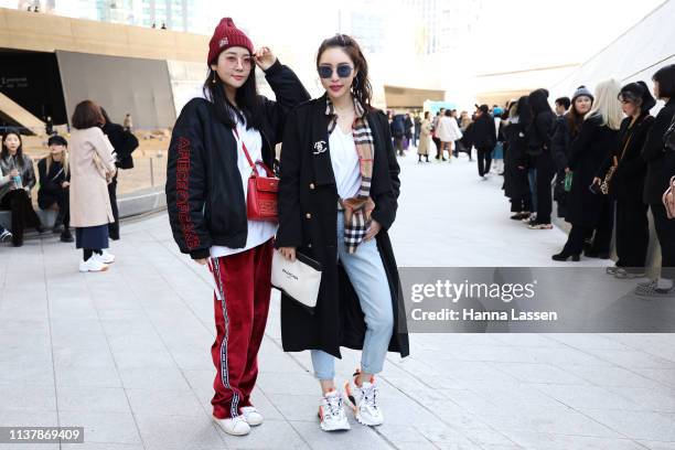 Guest wearing Burberry shirt, black wool jacket, Chanel brotch and Balenciaga clutch is seen at the Seoul Fashion Week 2019 F/W at Dongdaemun Design...