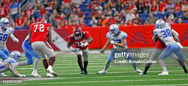 Trey Williams of the San Antonio Commanders runs thru the Salt Lake Stallions at Alamodome on March 23, 2019 in San Antonio, Texas.