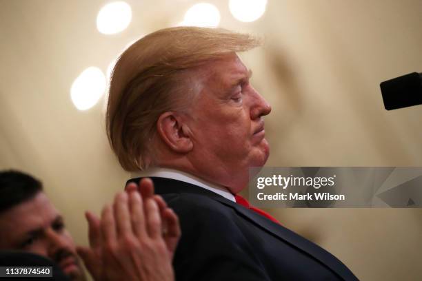 President Donald Trump pauses while speaking during an event recognizing the Wounded Warrior Project Soldier Ride in the East Room of the White...