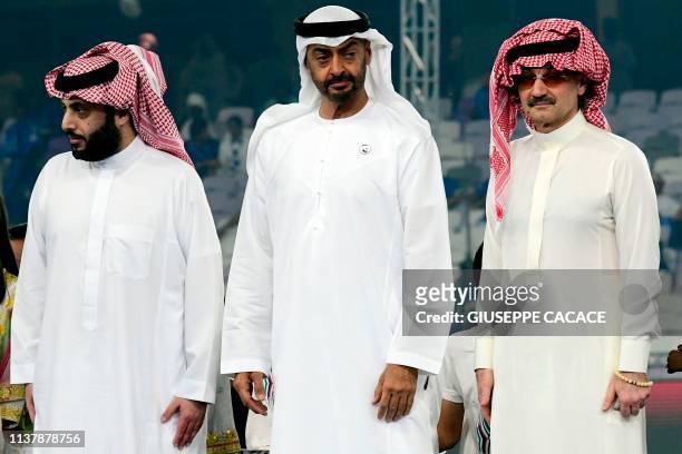 Abu Dhabi's Crown Prince Sheikh Mohammed bin Zayed al-Nahyan , Saudi Prince Al Walid bin Talal and Turki Al-Sheikh, head of the Union of Arab...
