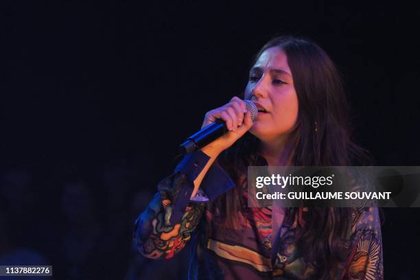 French singer Izia Higelin pays a tribute to his father, late singer Jacques Higelin, as she performs on stage during the 43rd edition of "Le...