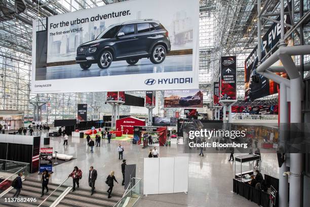 An advertisement for the Hyundai Motor Co. Venue sports utility vehicle hangs on display during the 2019 New York International Auto Show in New...