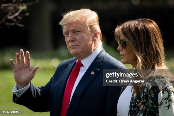 President Donald Trump and First Lady Melania Trump walk on the South Lawn while departing the White House for a weekend trip to Mar-A-Lago, April...