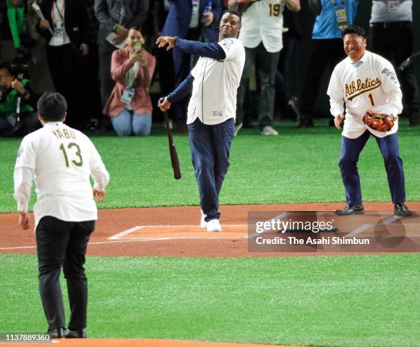 Keiichi Yabu, Ken Griffey Jr. And Akinori Iwamura attend the ceremonial first pitch prior to the game between Seattle Mariners and Oakland Athletics...