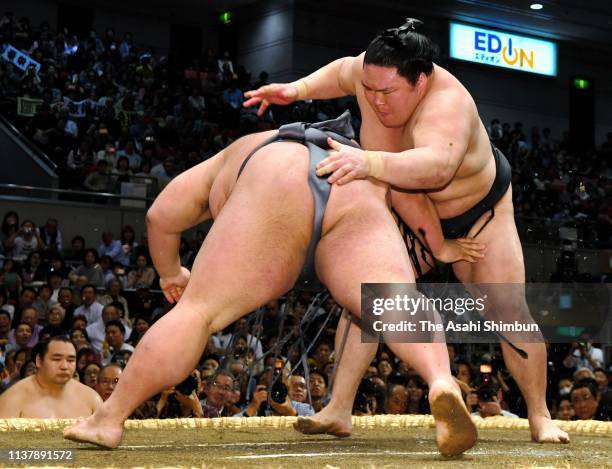 Ozeki Goeido throws sekiwake Takakeisho to win on day twelve of the Grand Sumo Spring Tournament at Edion Arena Osaka on March 21, 2019 in Osaka,...