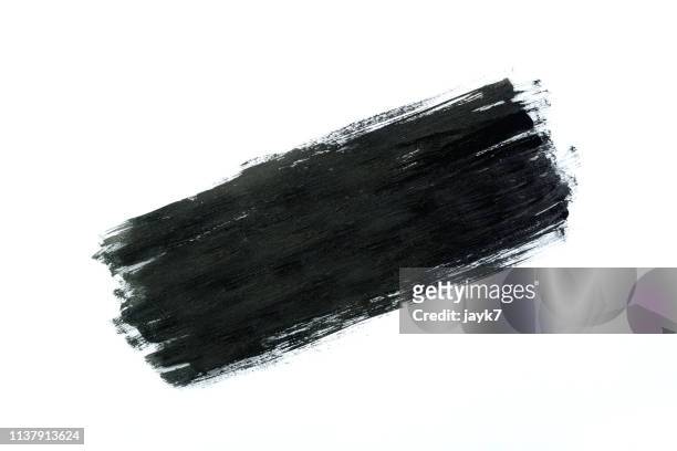 black paint - brush stroke on white stock-fotos und bilder