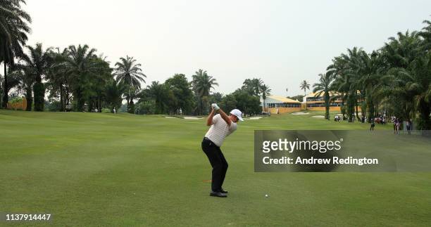 Scott Hend of Australia plays his second shot on the first play off match against Nacho Elvira of Spain during Day Four of the Maybank Championship...