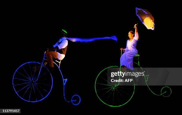 Actors of Prague's Black Theatre perform during a presentation of "The flying bike" at the Enrique Buenaventura Municipal theatre, in Cali,...