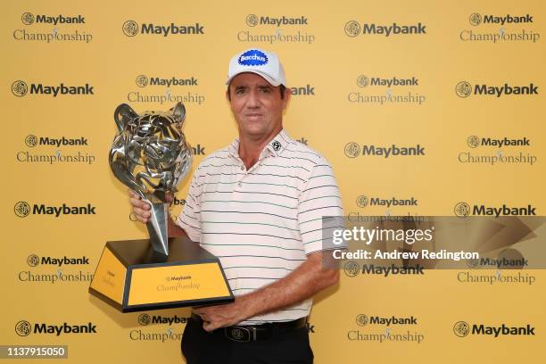 Scott Hend of Australia holds the trophy after he wins the play off match against Nacho Elvira of Spain during Day Four of the Maybank Championship...