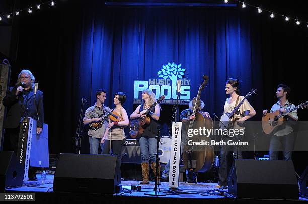 Ricky Skaggs presents a plague to BJ Cherryholmes, Molly Cherryholmes, Sandy Cherryholmes, Jerry Cherryholmes, Cia Cherryholmes and Skip Cherryholmes...