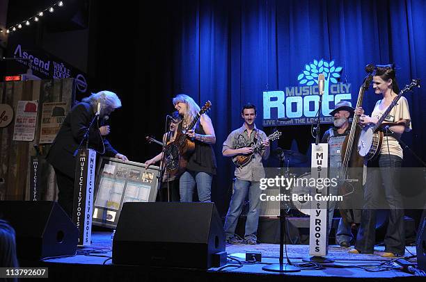 Ricky Skaggs presents a plaque to Molly Cherryholmes, Sandy Cherryholmes, BJ Cherryholmes, Jerry Cherryholmes and Cia Cherryholmes of the band...