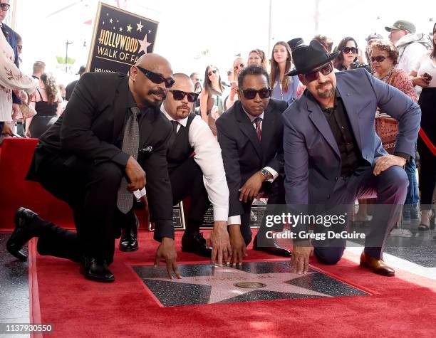 Lawrence 'DJ Muggs' Muggerud, Louis 'B-Real' Freese, Senen 'Sen Dog' Reyes and Eric 'Bobo' Correa of Cypress Hill pose at their Star on The Hollywood...