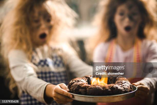 close up of burning cake! - poor kitchen stock pictures, royalty-free photos & images