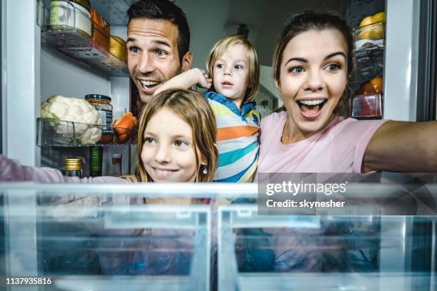 let's take something to eat from a fridge! - mom fridge stock pictures, royalty-free photos & images