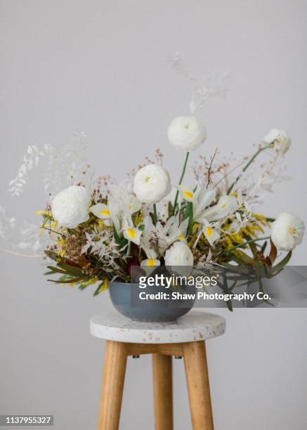 styled mid century modern wedding tablescape in warehouse - flower arrangement stock pictures, royalty-free photos & images