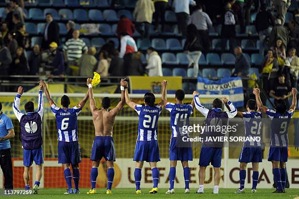 Porto's players celebrate after the UEFA Europa League semi-final second leg football match between Villarreal and Porto at the Madrigal Stadium in...