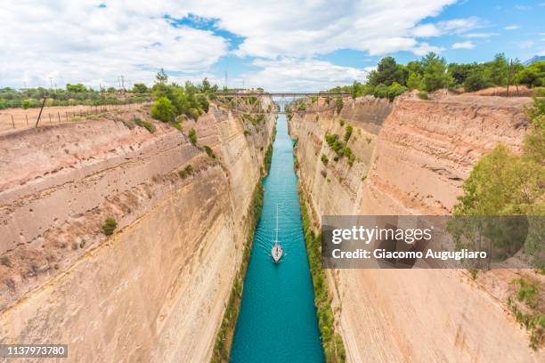 nautical vessel sailing through the corinth canal, corinthia region, greece, europe - enge stock-fotos und bilder