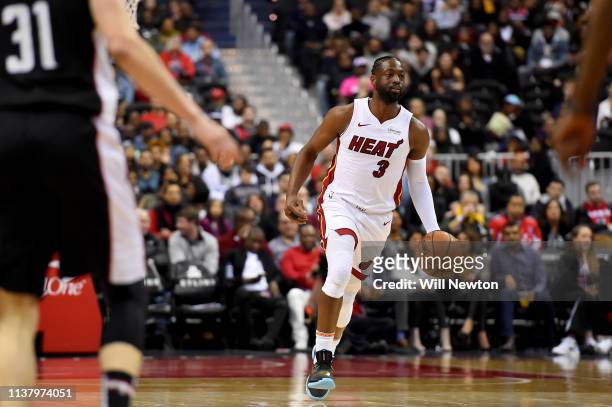Dwyane Wade of the Miami Heat dribbles against the Washington Wizards during the first half at Capital One Arena on March 23, 2019 in Washington, DC....