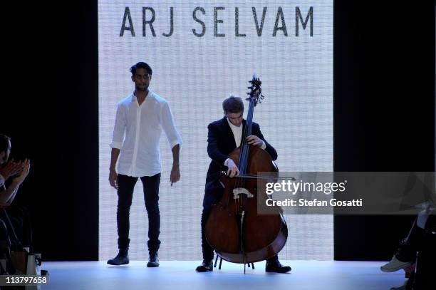 Designer Arj Selvam walks the catwalk after his show during the New Generation 1 catwalk during Rosemount Australian Fashion Week Spring/Summer...