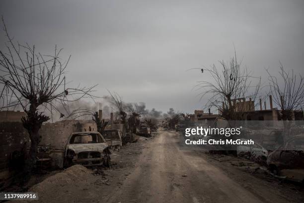 Destroyed vehicles are seen in the final ISIL encampment on March 24, 2019 in Baghouz, Syria. The Kurdish-led and American-backed Syrian Defense...