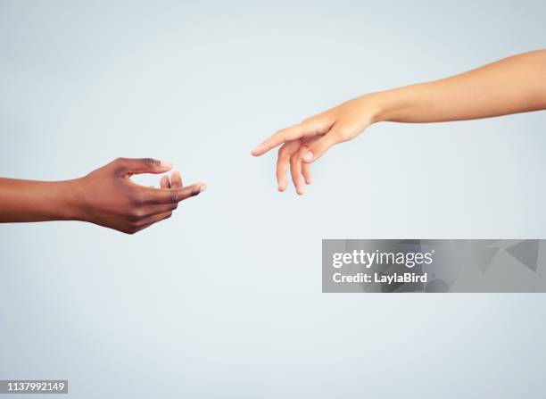 reach out and make that connection - two hands reaching stock pictures, royalty-free photos & images