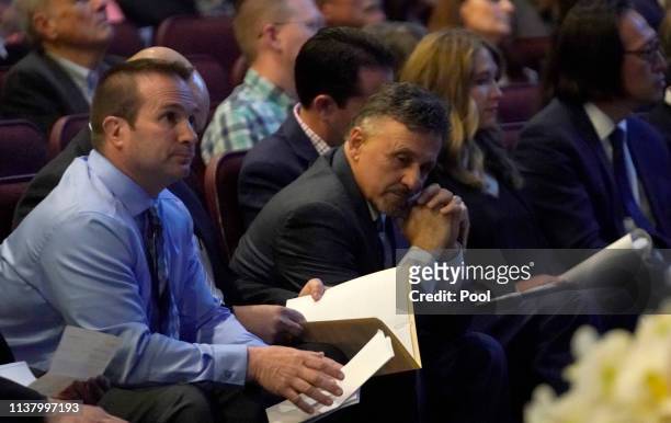 Tom Tonelli, a teacher at Columbine High School sits with former Columbine principal Frank DeAngelis as they attend a service on April 18, 2019 in...