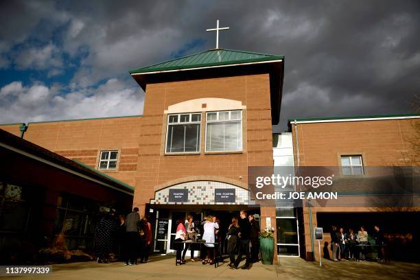 People arrive to attend "Columbine 20 Years Later: A Faith-based Remembrance Service" for the victims of the Columbine High School shooting at...