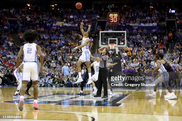 View of the tipoff between the North Carolina Tar Heels and the Washington Huskies to start their game in the Second Round of the NCAA Basketball...