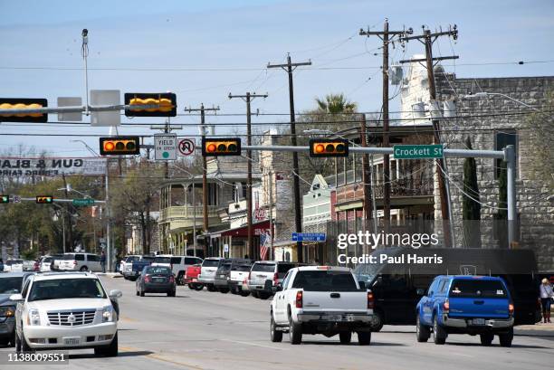 Cars drive on Main Street March 16, 2019 in Fredericksburg, Texas